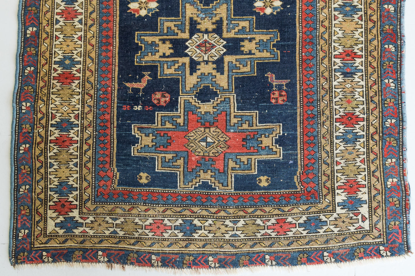 Handwoven Antique - Blue Ground Persian Rug with Bird-like Figures