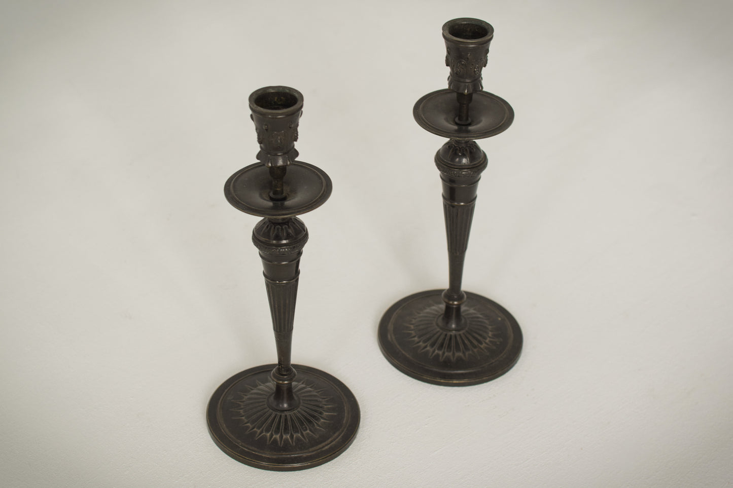 A Classic Pair of Bronze Candlesticks_3