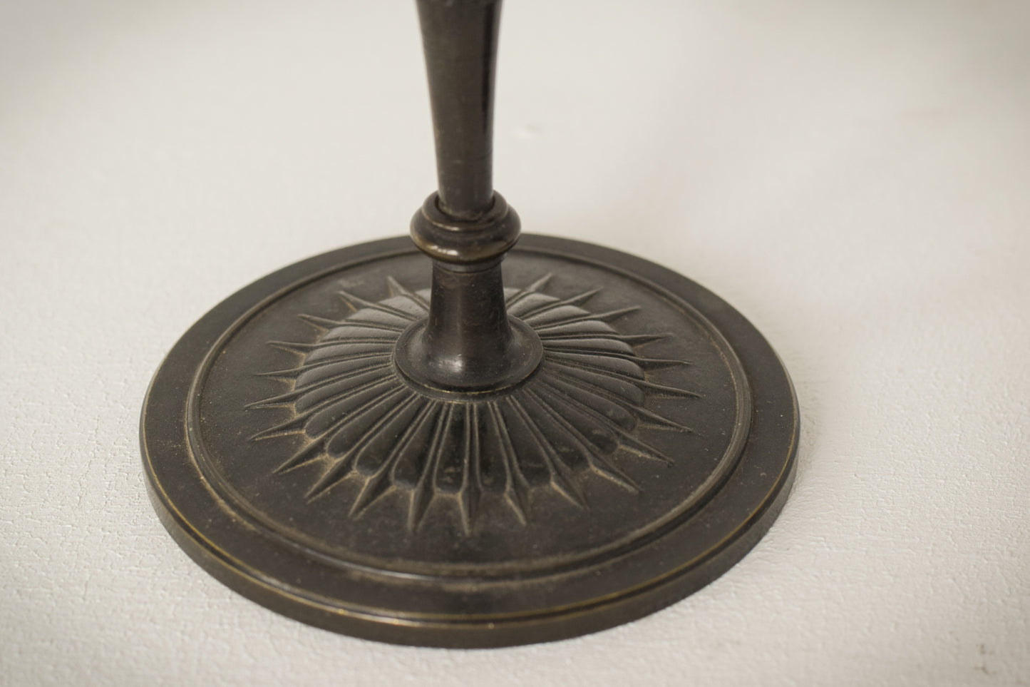 A Classic Pair of Bronze Candlesticks_Detail base