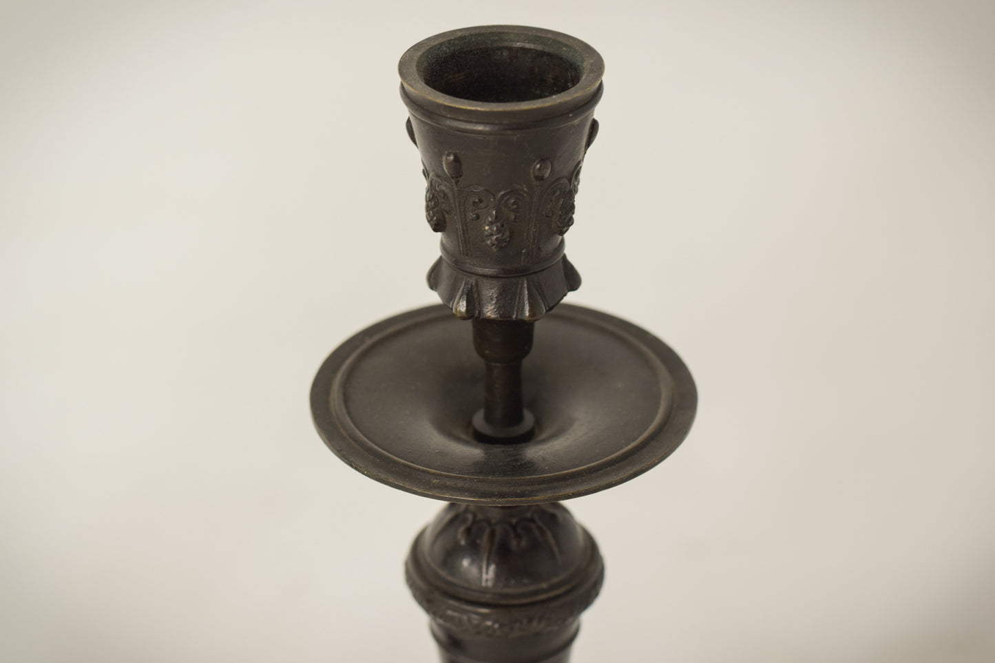 A Classic Pair of Bronze Candlesticks_Detail top