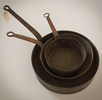 Three Antique Copper and Iron Handled Saucepans