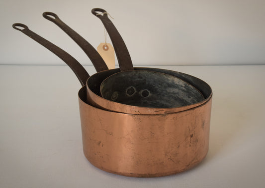 Three Copper and Iron Handled Saucepans