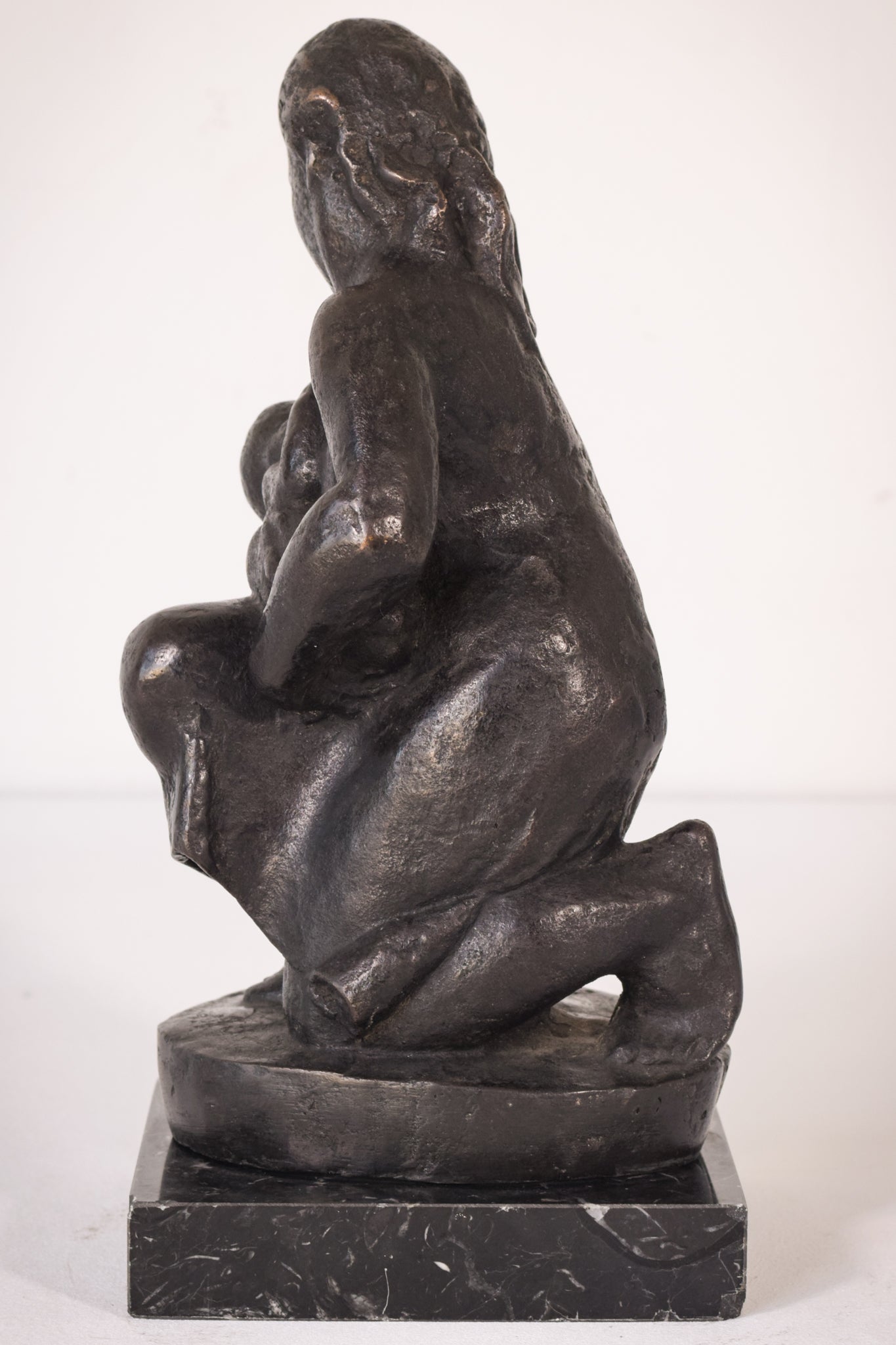 Bronze Mother Feeding Child by Manuel Martinez Hugué, 1935