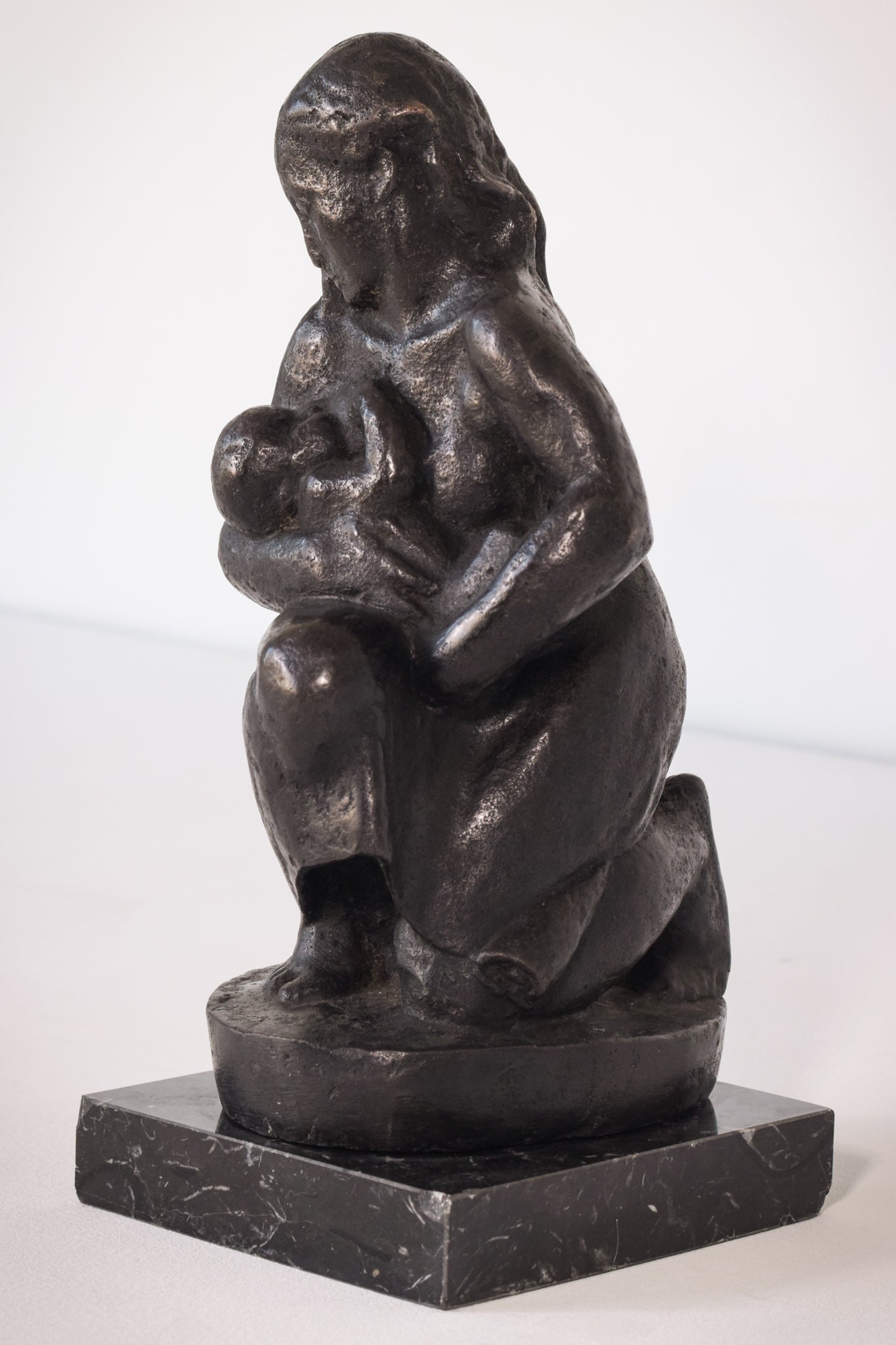 Bronze Mother Feeding Child by Manuel Martinez Hugué, 1935