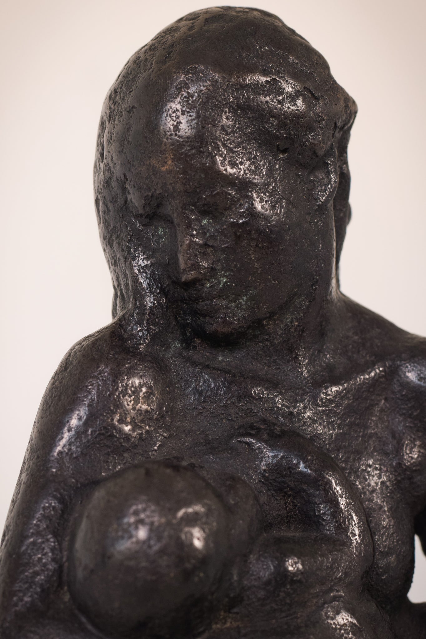 Bronze Mother Feeding Child by Manuel Martinez Hugué, 1935