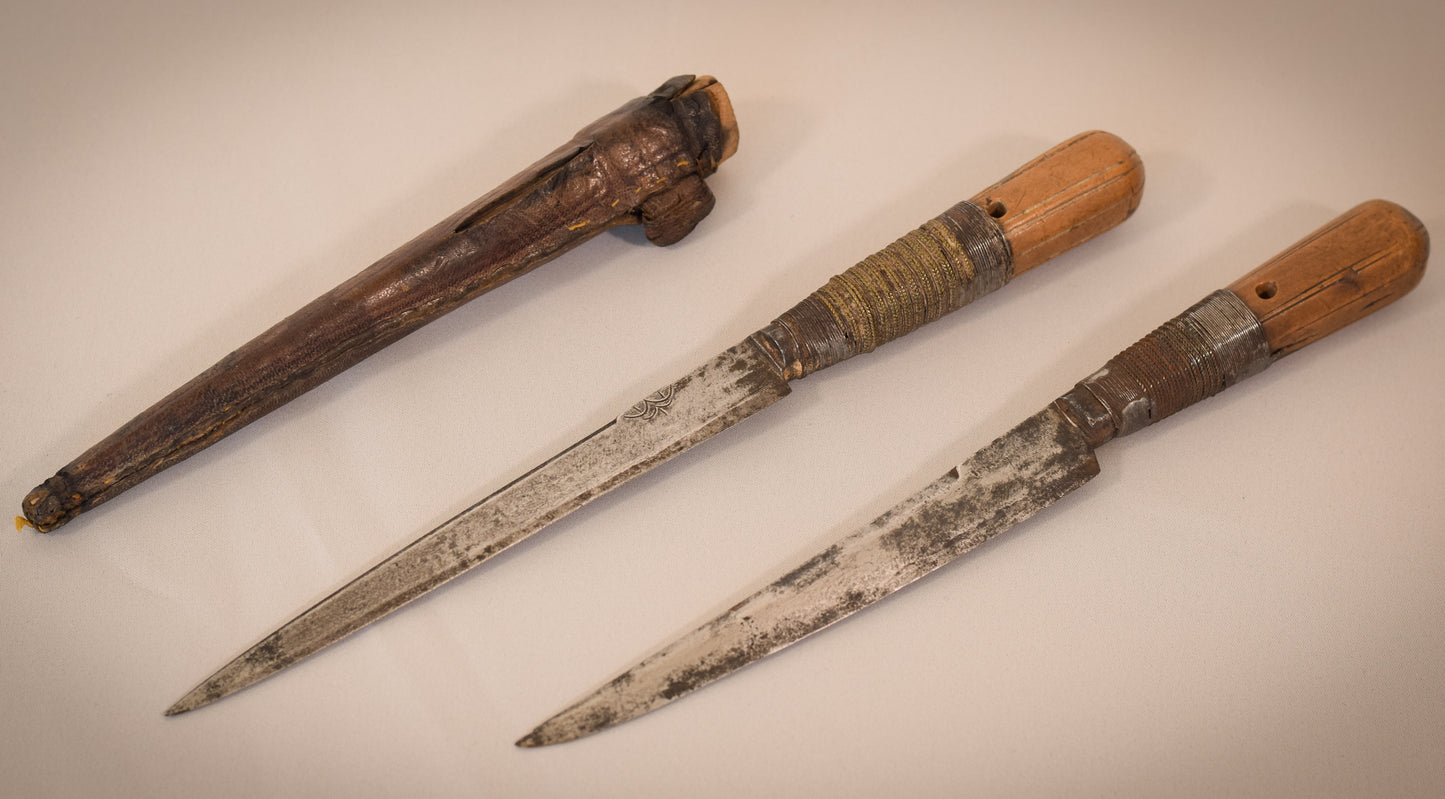 Two early 17th or 18th century hunting knifes or daggers one with leather sheaf