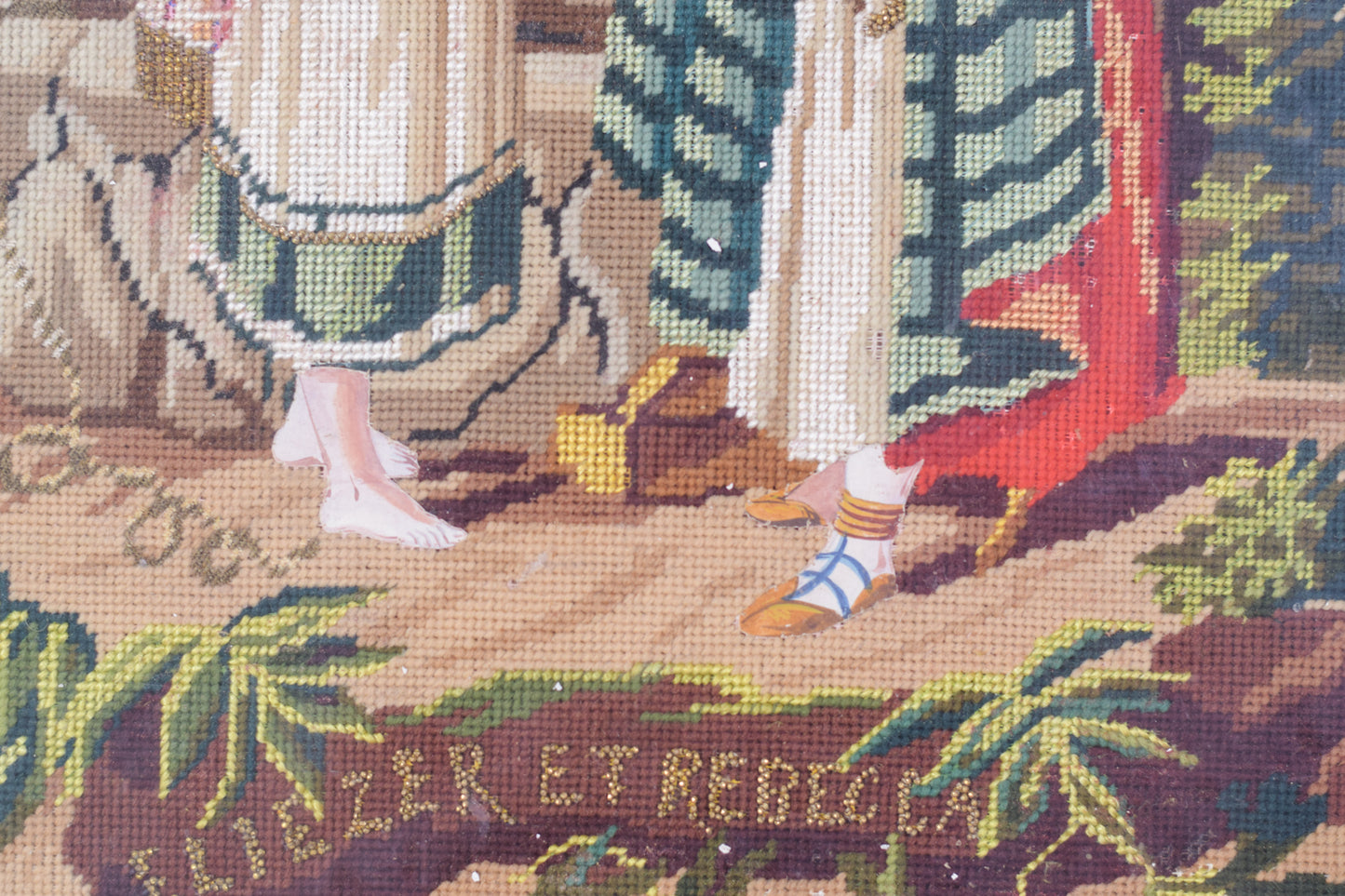 Framed embroidery 'Rebecca and Elezier at the Well'_Title