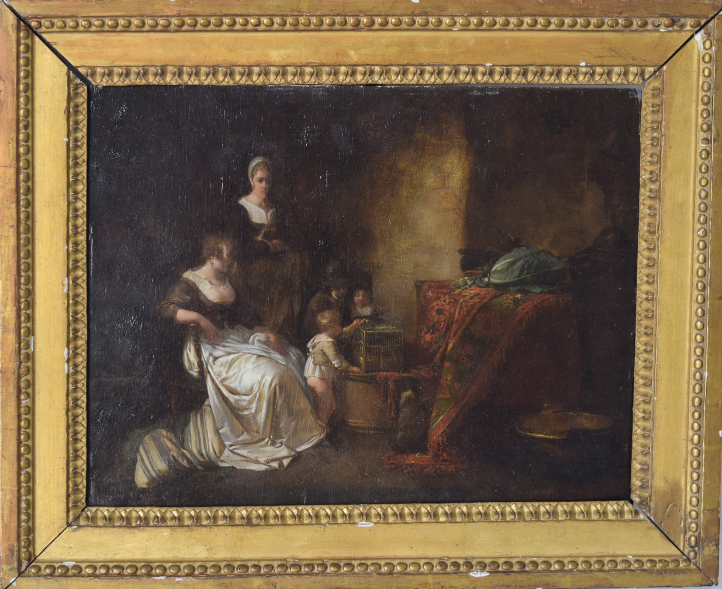 Late 18th Century Domestic scene with children feeding a bird in a cage with mother and maid_Framed