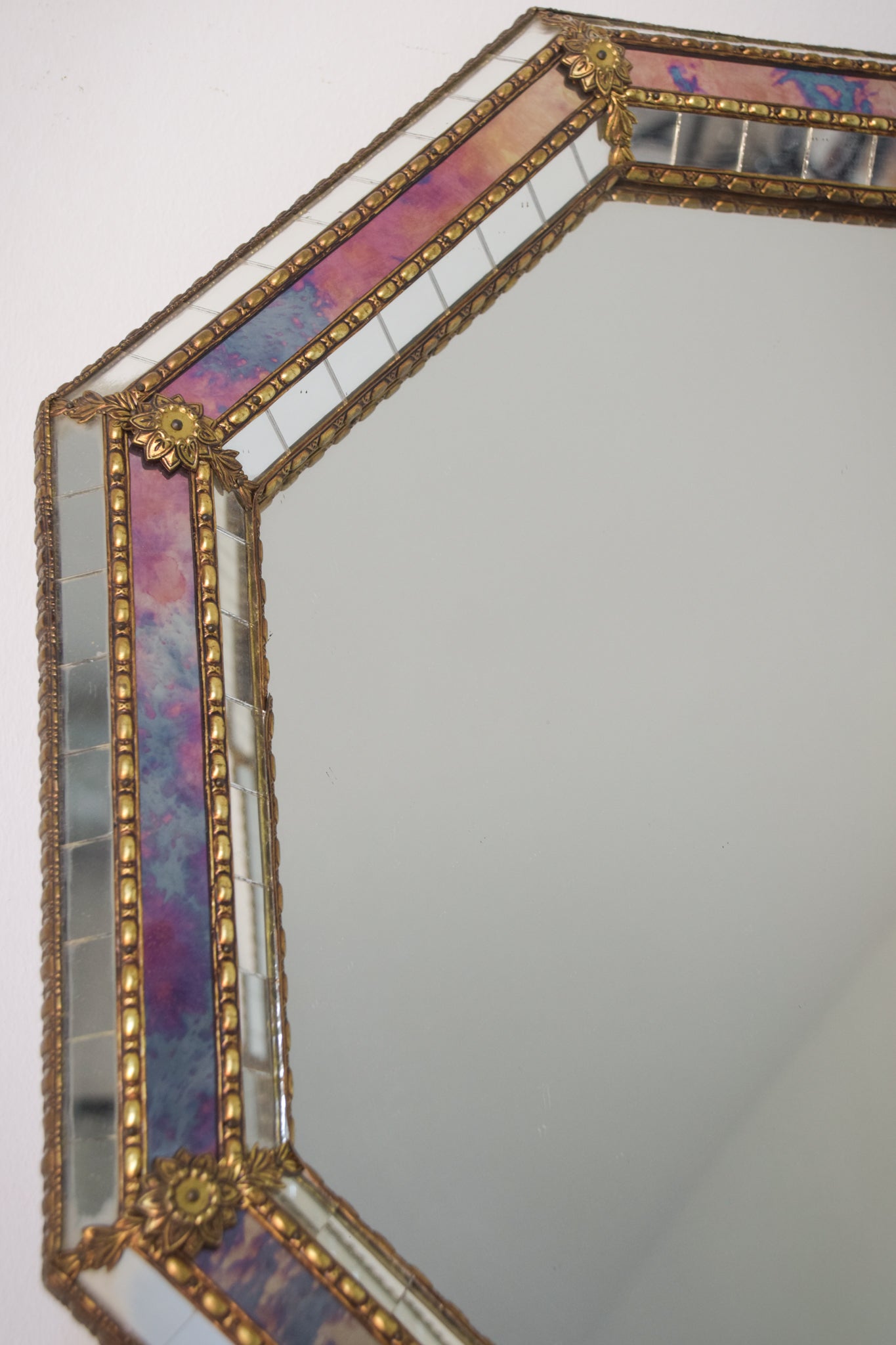 Octagonal Mirror with a Coloured Border and Carved Features